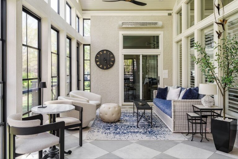 wide shot of a finished modern sunroom addition in Overland Park with tall windows